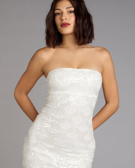 This prom dress, the Lilah Beaded Scallop Mini Dress , features a sleek, floor-length design with trend-forward details that capture the excitement of Prom 2026.