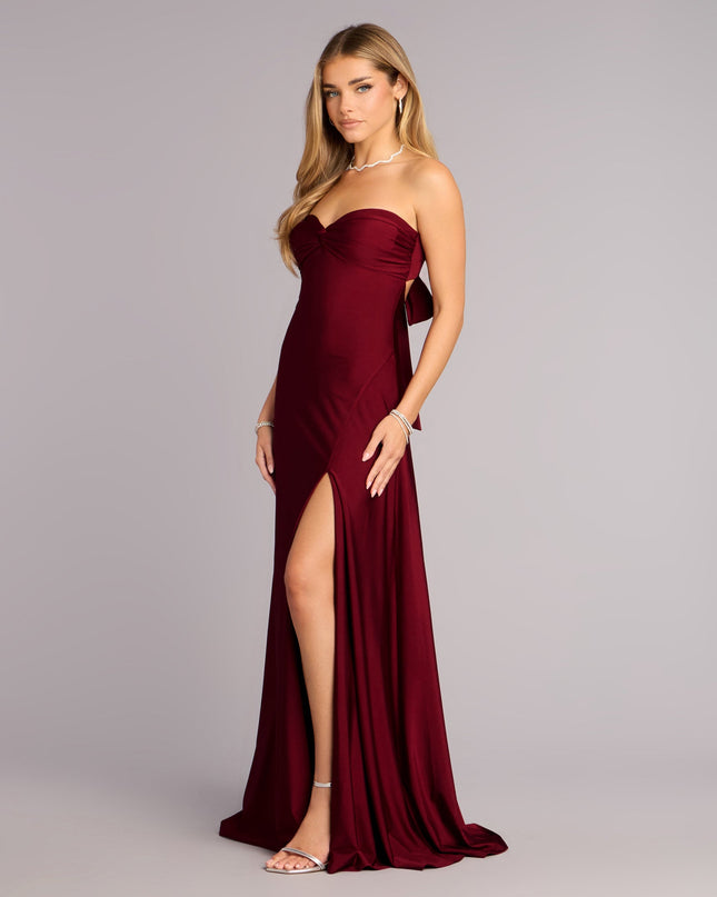 Own Prom 2026 in the Madeline Strapless Tie-Back A-Line Dress,  a wine prom dress designed with a flattering silhouette and elevated details that feel modern and true to your style.