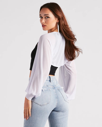 The Sheer Mesh Blouson Sleeve Bolero helps create a chic women's white cocktail outfit with a trendy texture and stylish design, ideal for wedding guest cocktail outfits or dinner parties.