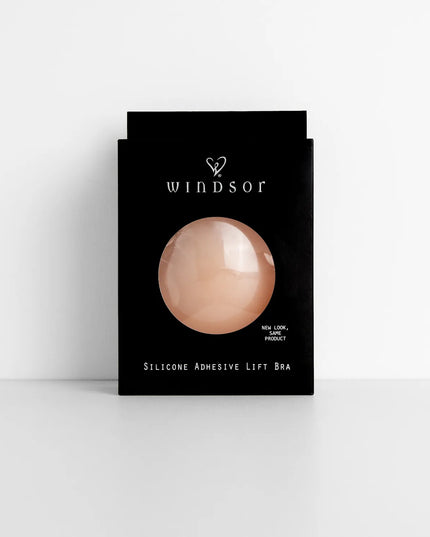 The Silicone Adhesive Lifting Bra in natural brings sleek style to any graduation outfit, from cap and gown to after-party.